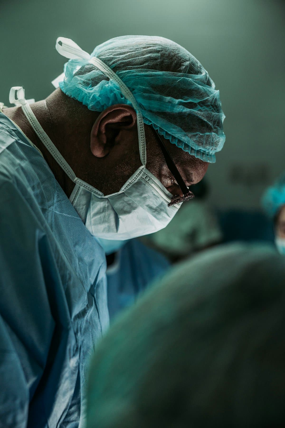 Anesthesiologist in scrubs and surgical cap